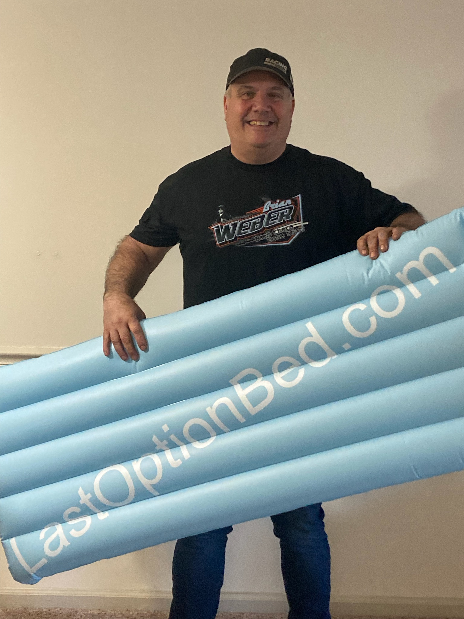 Brian Weber holding his new Last Option Bed